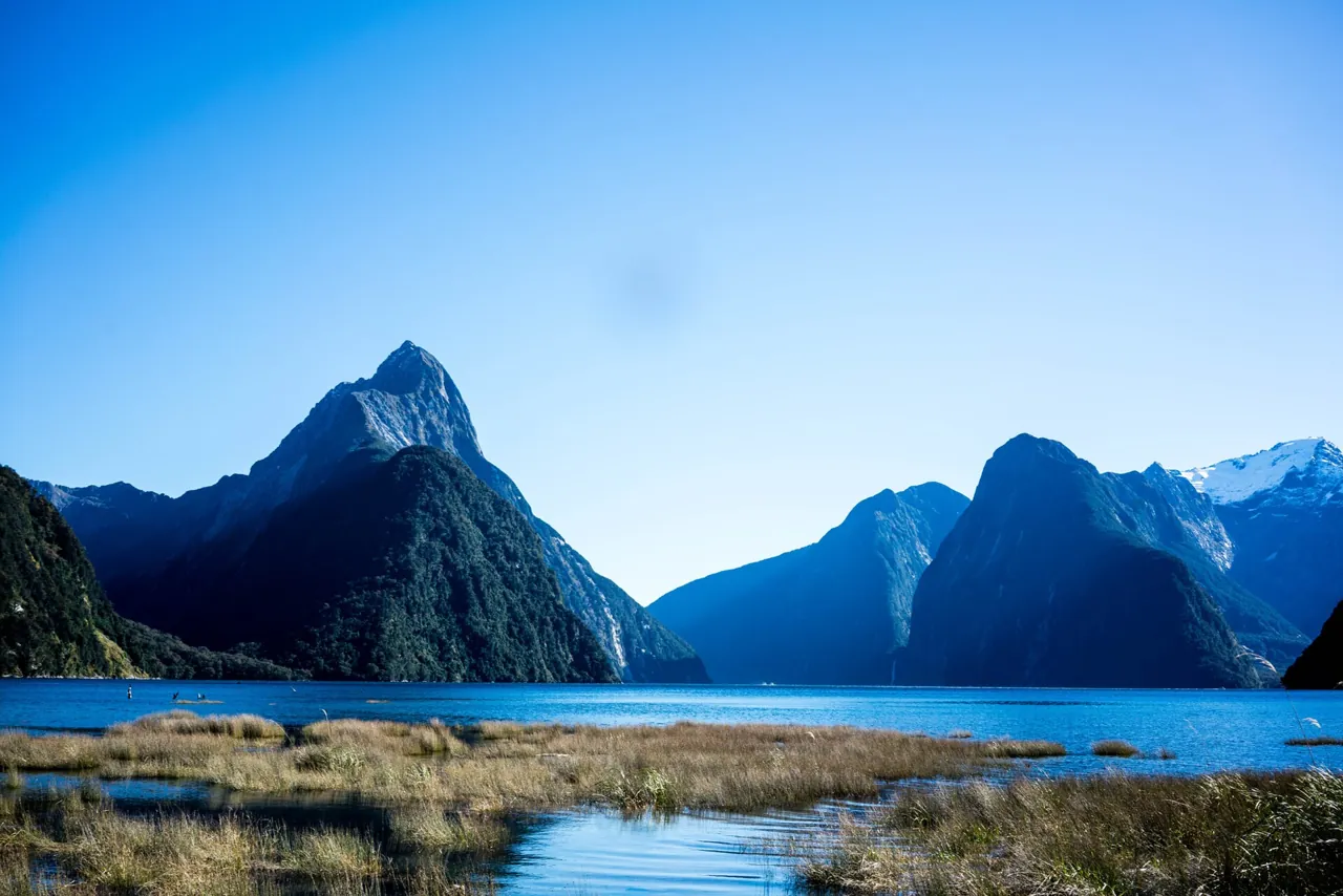 Mitre Peak and the mountains of Milford Sound on a clear blue day